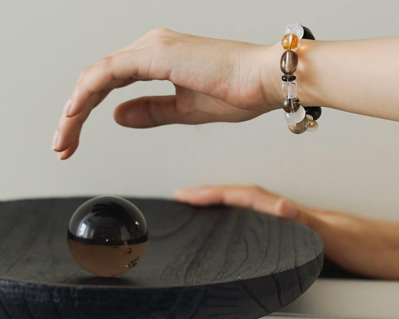 CIRCLEARA handcrafted crystal bracelet for mindfulness and daily energy protection, held as a physical anchor for grounding.