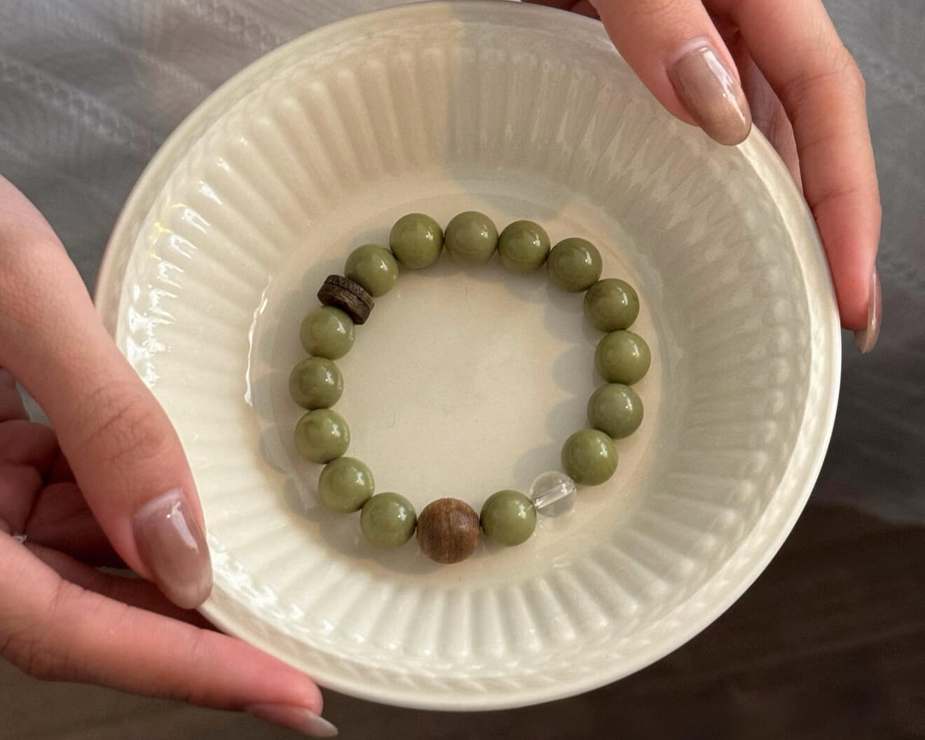 Handcrafted gemstone bracelet featuring natural grounding stones, designed by artisans as a unique soulful accessory for energy protection.