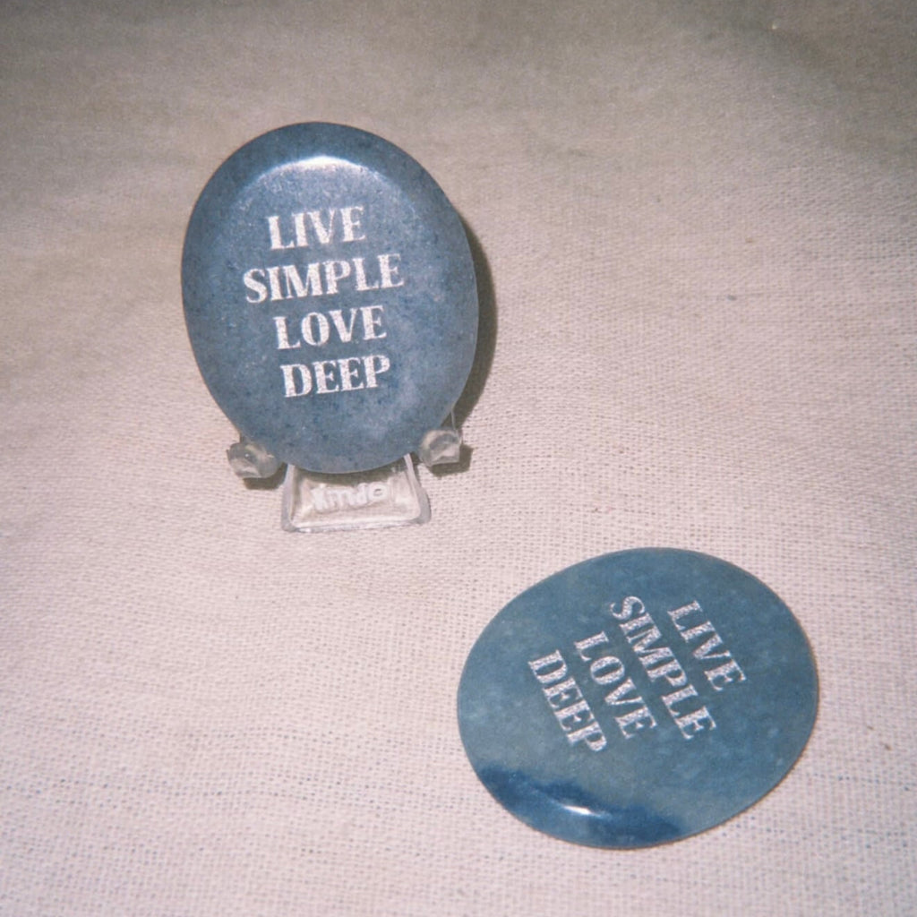 CIRCLEARA "Live Simple, Love Deep" etched Blue Dumortierite stone. A tactile calming mineral designed for the "Soulful Minimalist," serving as an anchor of patience and intentional living.