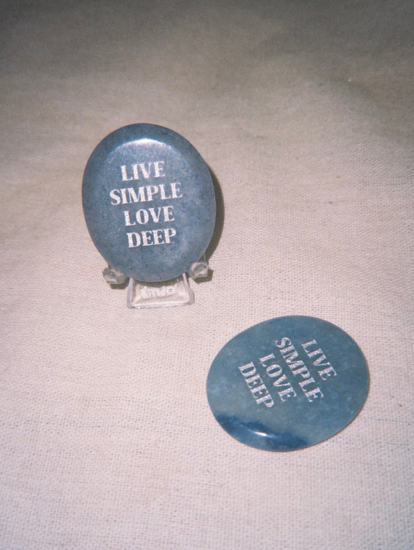 CIRCLEARA "Live Simple, Love Deep" etched Blue Dumortierite stone. A tactile calming mineral designed for the "Soulful Minimalist," serving as an anchor of patience and intentional living.
