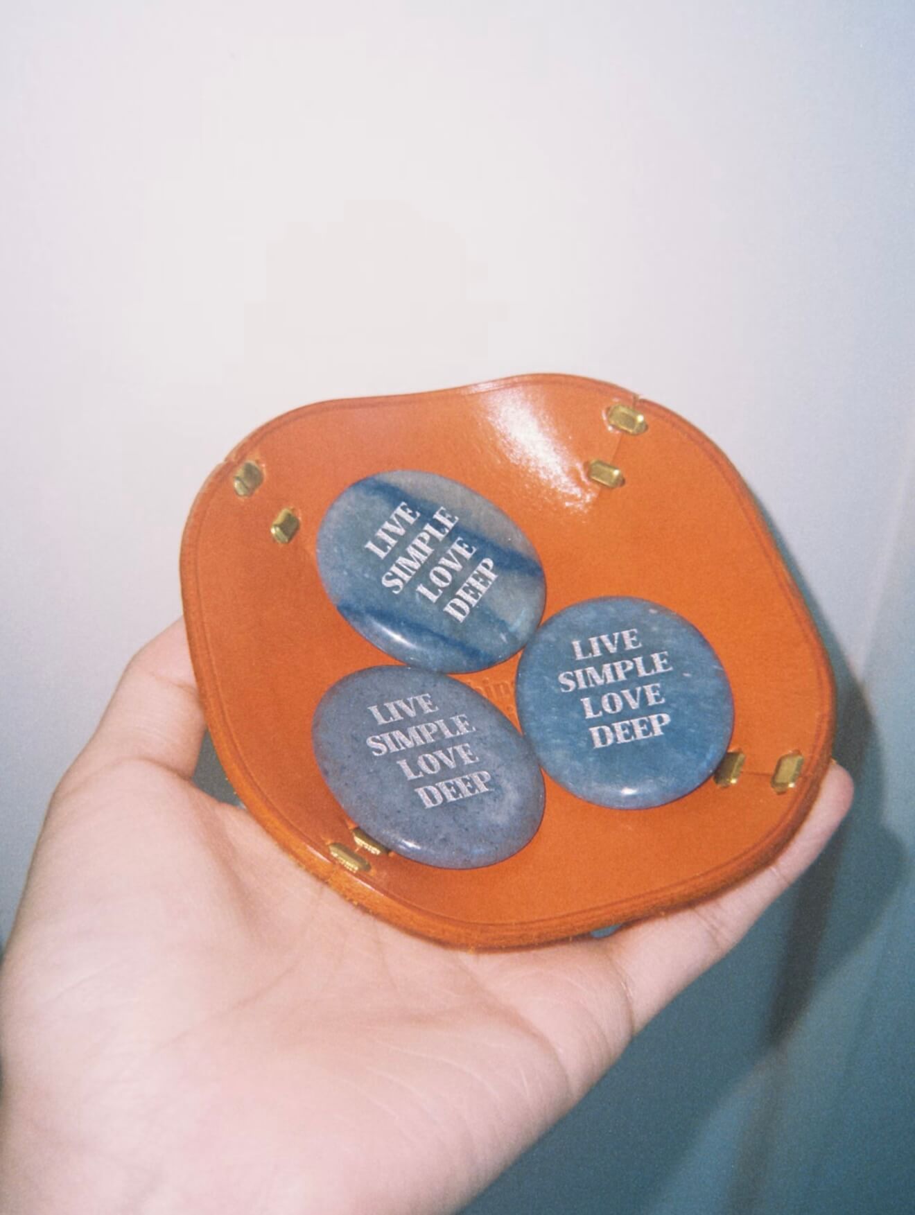 CIRCLEARA "Live Simple, Love Deep" etched Blue Dumortierite stone. A tactile calming mineral designed for the "Soulful Minimalist," serving as an anchor of patience and intentional living.