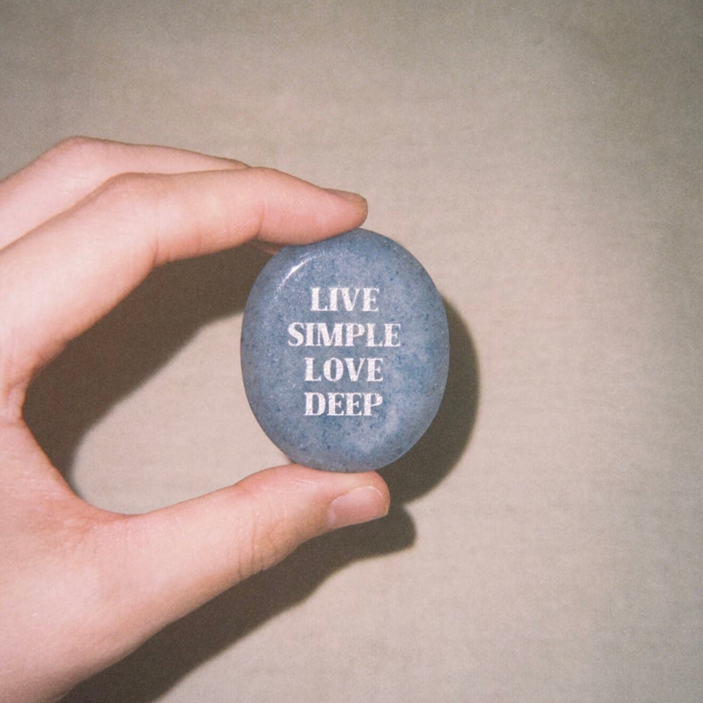 CIRCLEARA "Live Simple, Love Deep" etched Blue Dumortierite stone. A tactile calming mineral designed for the "Soulful Minimalist," serving as an anchor of patience and intentional living.