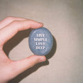 CIRCLEARA "Live Simple, Love Deep" etched Blue Dumortierite stone. A tactile calming mineral designed for the "Soulful Minimalist," serving as an anchor of patience and intentional living.