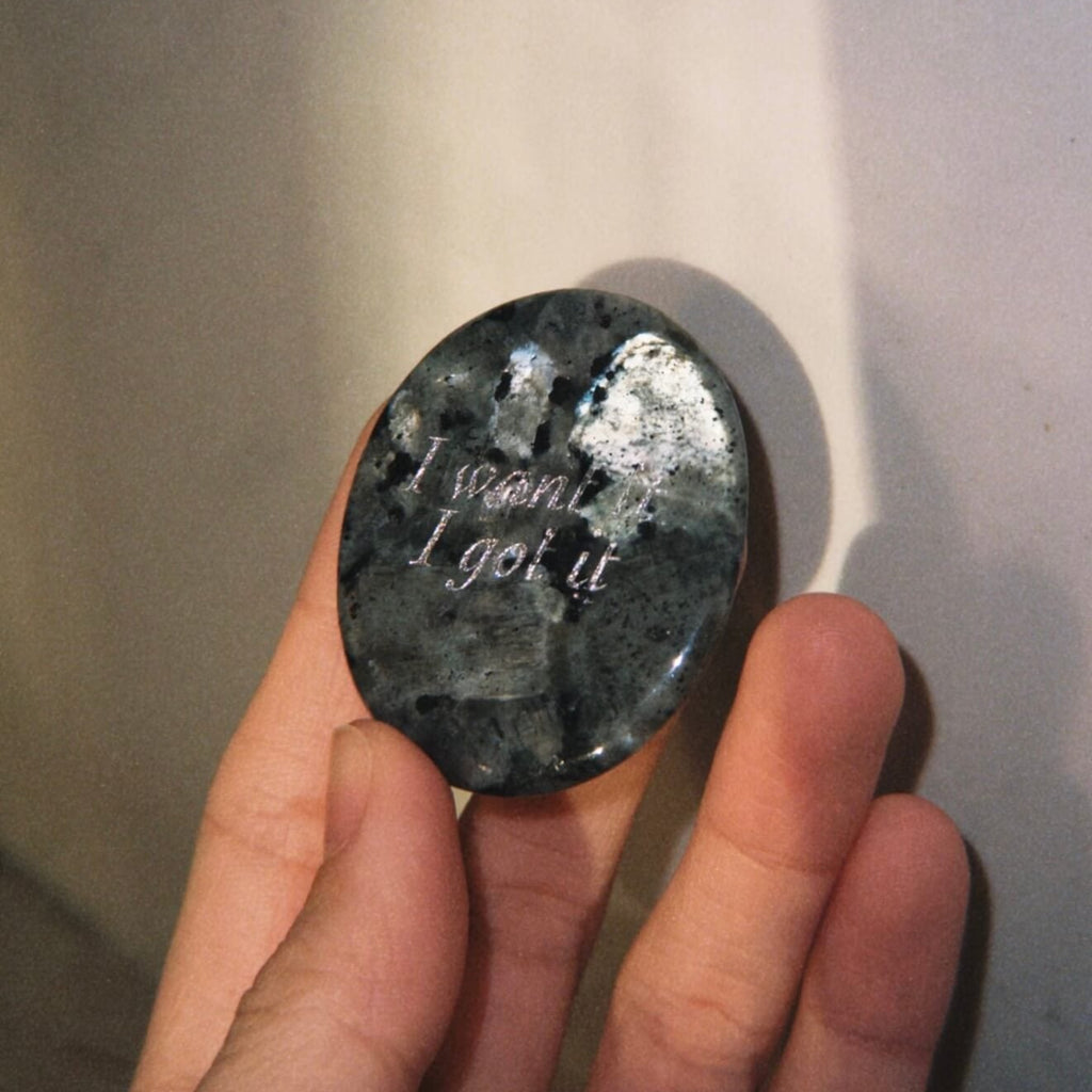 CIRCLEARA "I want it, I got it" etched Labradorite stone. A manifestation tool for ambition and focus, featuring the stone's signature mystical glow and gold-leaf vow.
