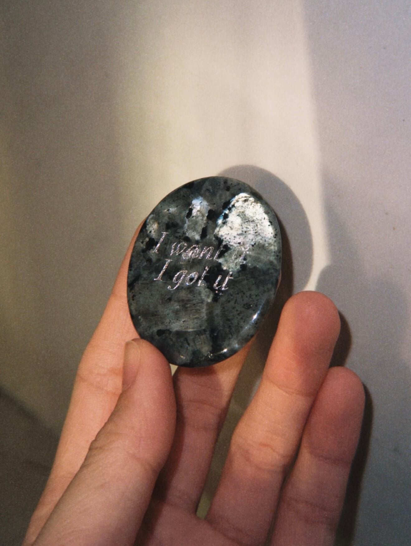 CIRCLEARA "I want it, I got it" etched Labradorite stone. A manifestation tool for ambition and focus, featuring the stone's signature mystical glow and gold-leaf vow.