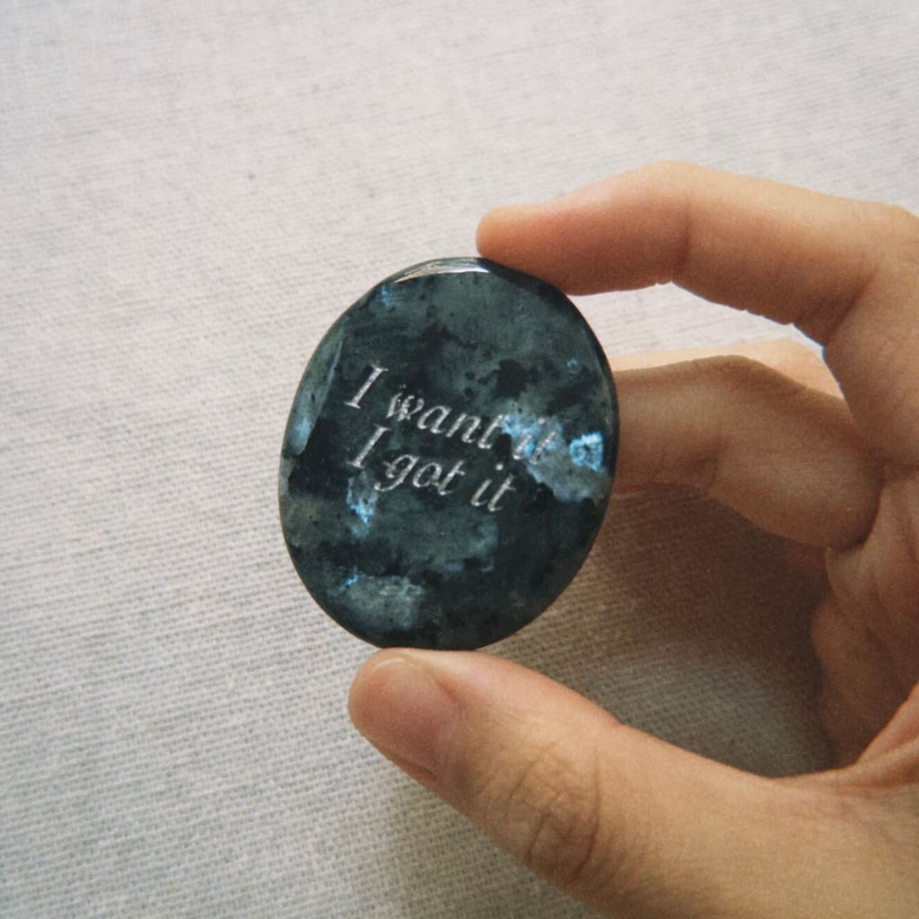 CIRCLEARA "I want it, I got it" etched Labradorite stone. A manifestation tool for ambition and focus, featuring the stone's signature mystical glow and gold-leaf vow.