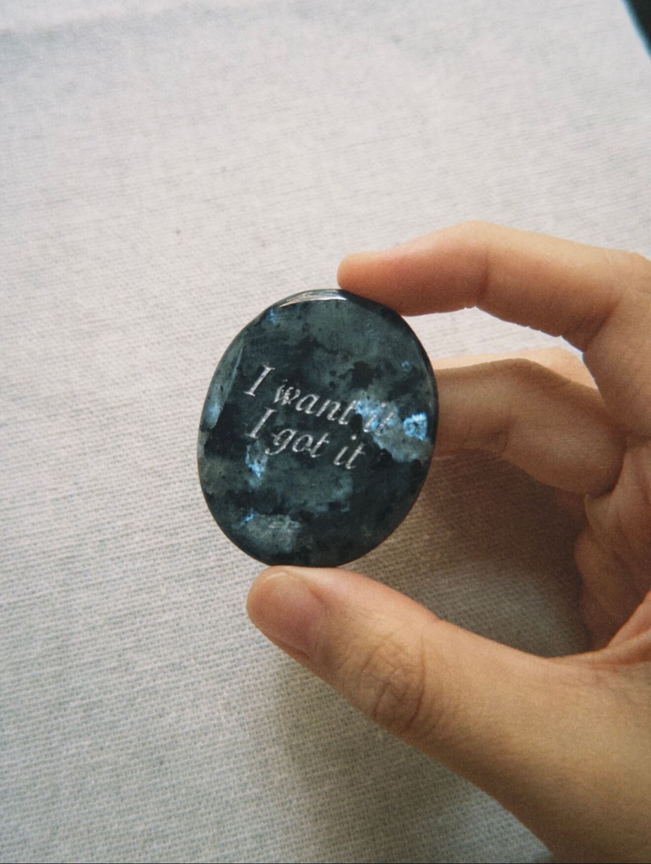 CIRCLEARA "I want it, I got it" etched Labradorite stone. A manifestation tool for ambition and focus, featuring the stone's signature mystical glow and gold-leaf vow.