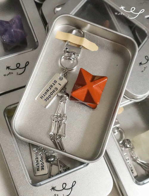 A collection of CIRCLEARA Merkaba star crystal charms with sturdy clips, designed as portable energy anchors for bags and keys.