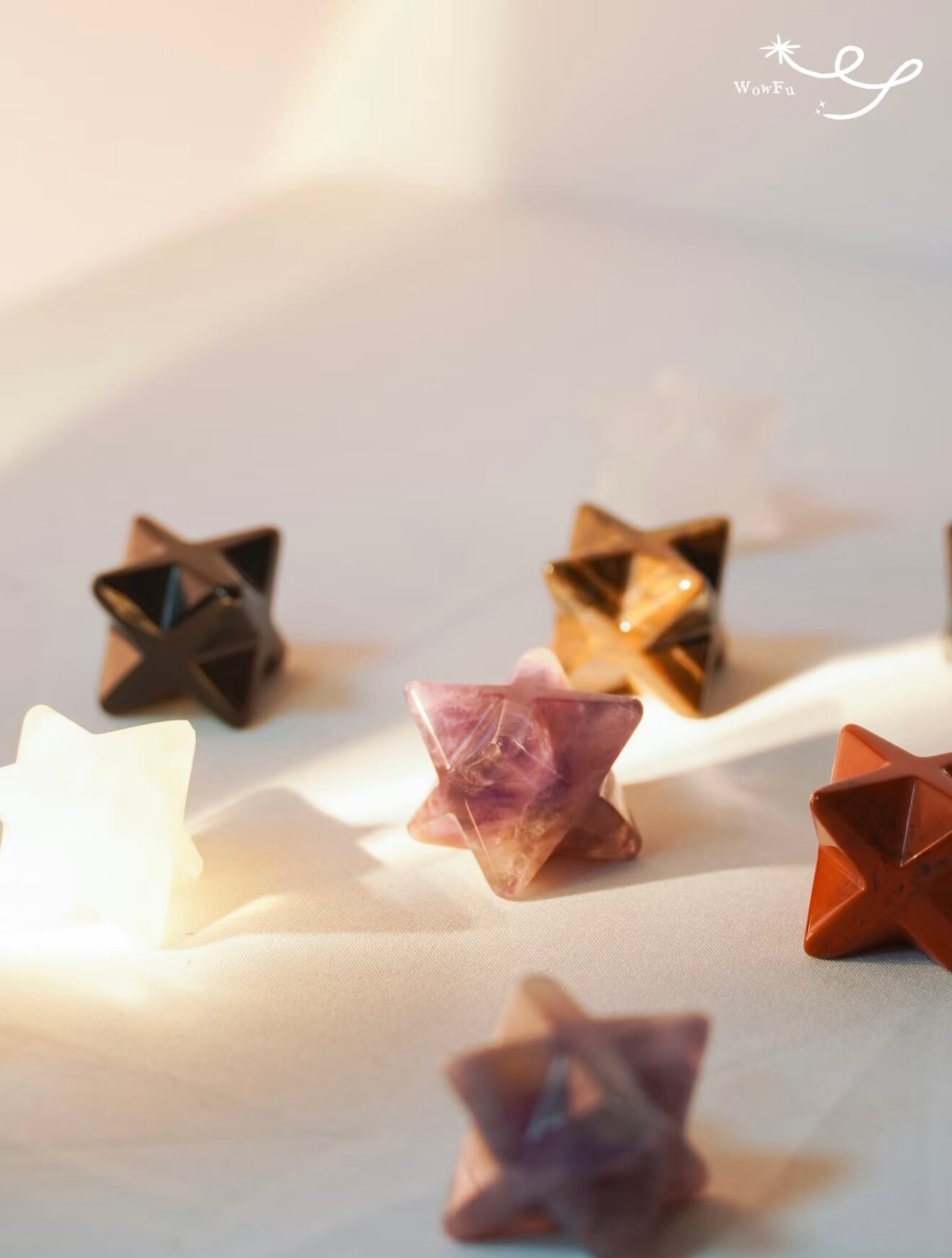 A collection of CIRCLEARA Merkaba star crystal charms with sturdy clips, designed as portable energy anchors for bags and keys.