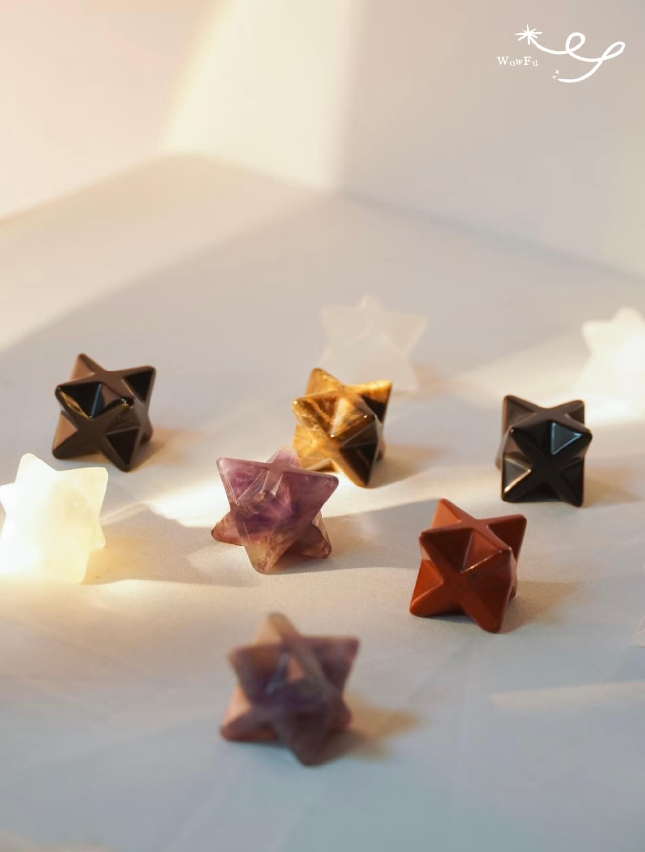 A collection of CIRCLEARA Merkaba star crystal charms with sturdy clips, designed as portable energy anchors for bags and keys.