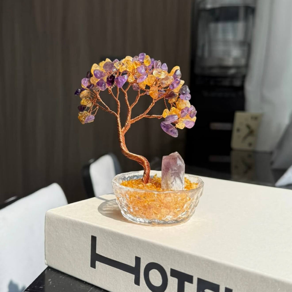 Handcrafted Amethyst and Citrine crystal energy tree desk ornament, featuring a raw, uncut Amethyst pillar anchor in a clear glass basin with golden crystal chips.