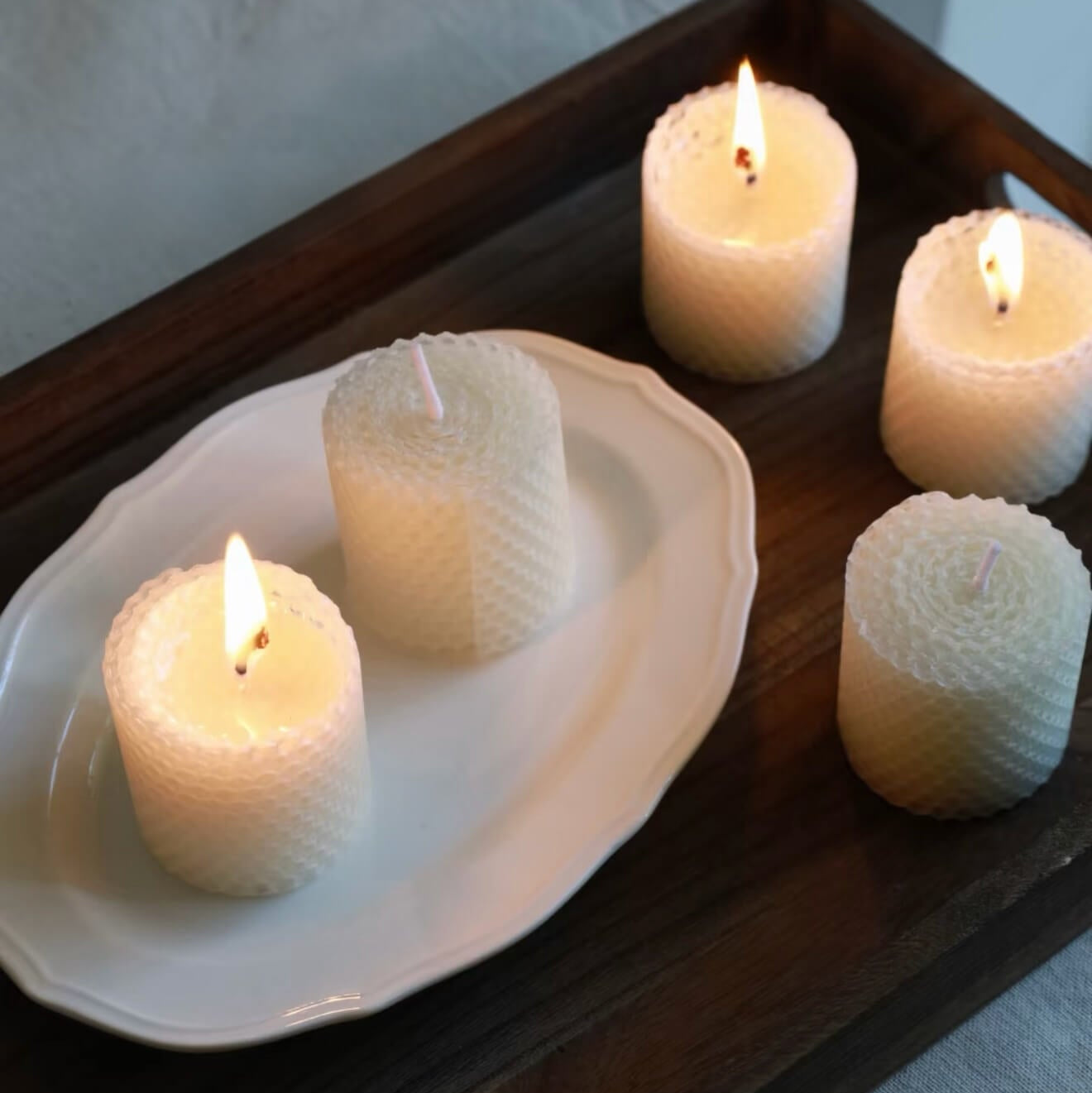 Handcrafted Pure Alabaster white beeswax honeycomb candle set by CIRCLEARA, featuring textured geometric pillar candles lit on a minimalist zen background for meditation.