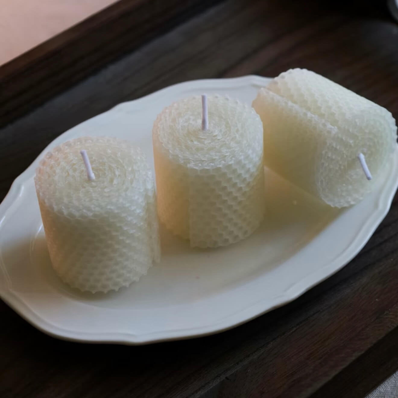 Handcrafted Pure Alabaster white beeswax honeycomb candle set by CIRCLEARA, featuring textured geometric pillar candles lit on a minimalist zen background for meditation.