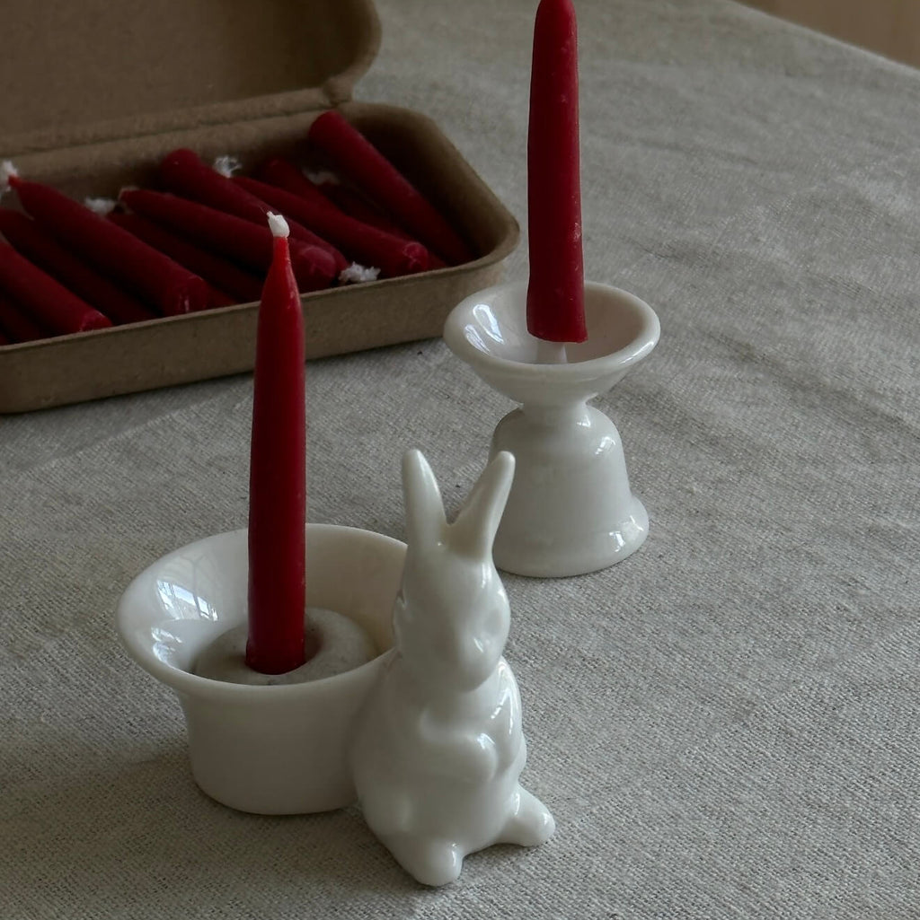 Handcrafted 20-minute Crimson Velvet beeswax meditation candle set by CIRCLEARA, featuring slim red taper candles in a sustainable kraft package with a minimalist ceramic holder.