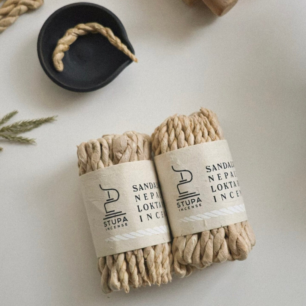 A bundled stack of CIRCLEARA Himalayan rope incense wrapped in raw paper, showcasing the traditional Nepalese hand-rolled texture.