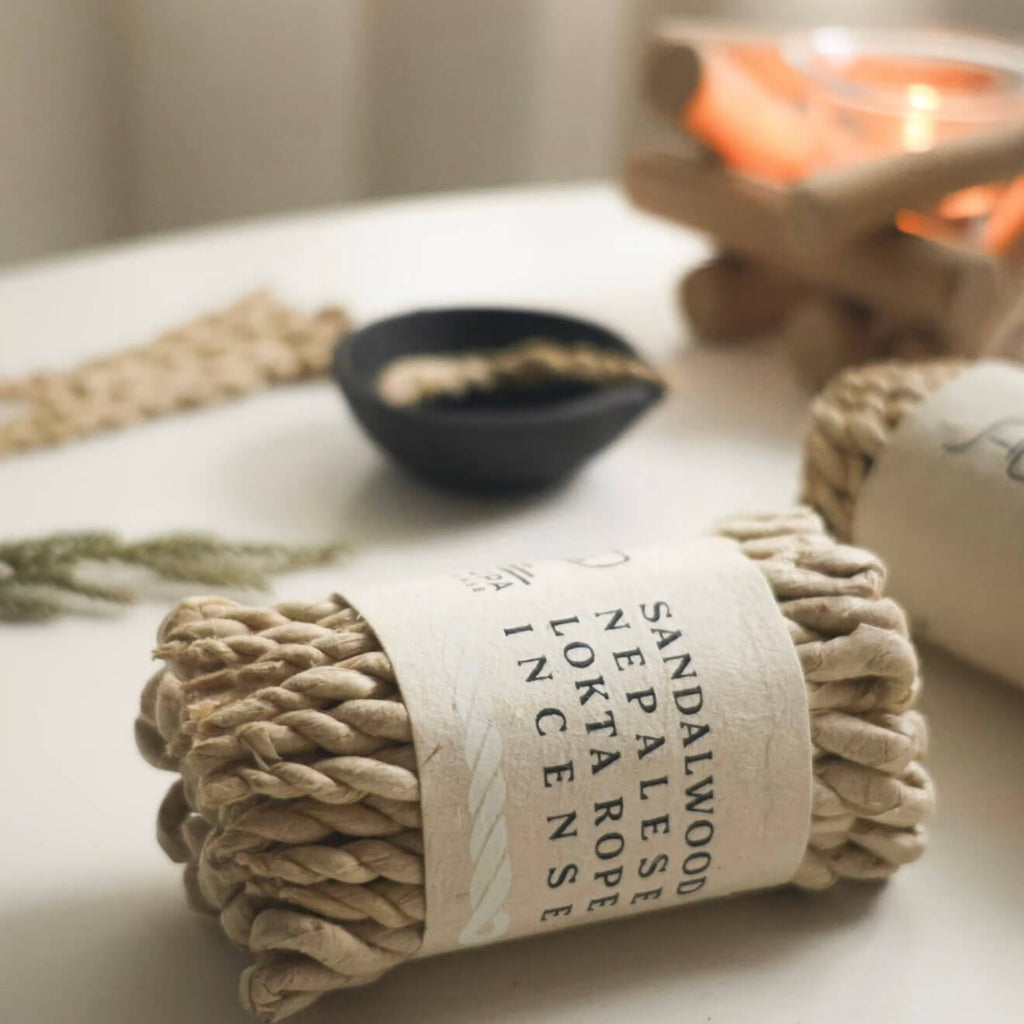 A bundled stack of CIRCLEARA Himalayan rope incense wrapped in raw paper, showcasing the traditional Nepalese hand-rolled texture.