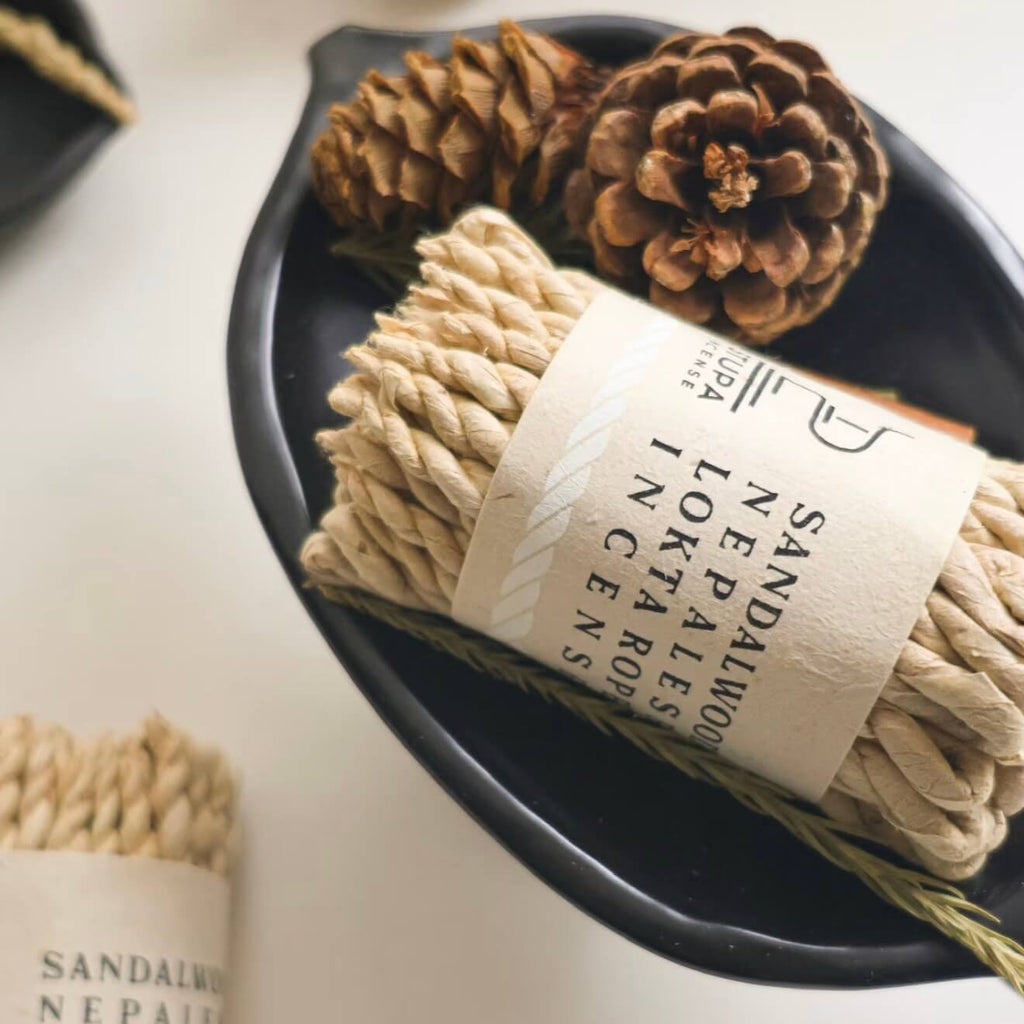 A bundled stack of CIRCLEARA Himalayan rope incense wrapped in raw paper, showcasing the traditional Nepalese hand-rolled texture.