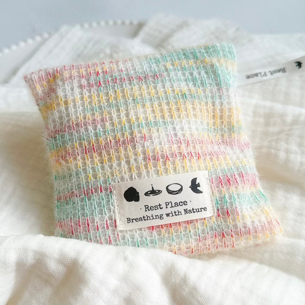 Handcrafted Earth Haven herbal balance sachet by CIRCLEARA, featuring a multi-color artisan woven pouch filled with premium natural lavender and cedarwood botanical herbs.