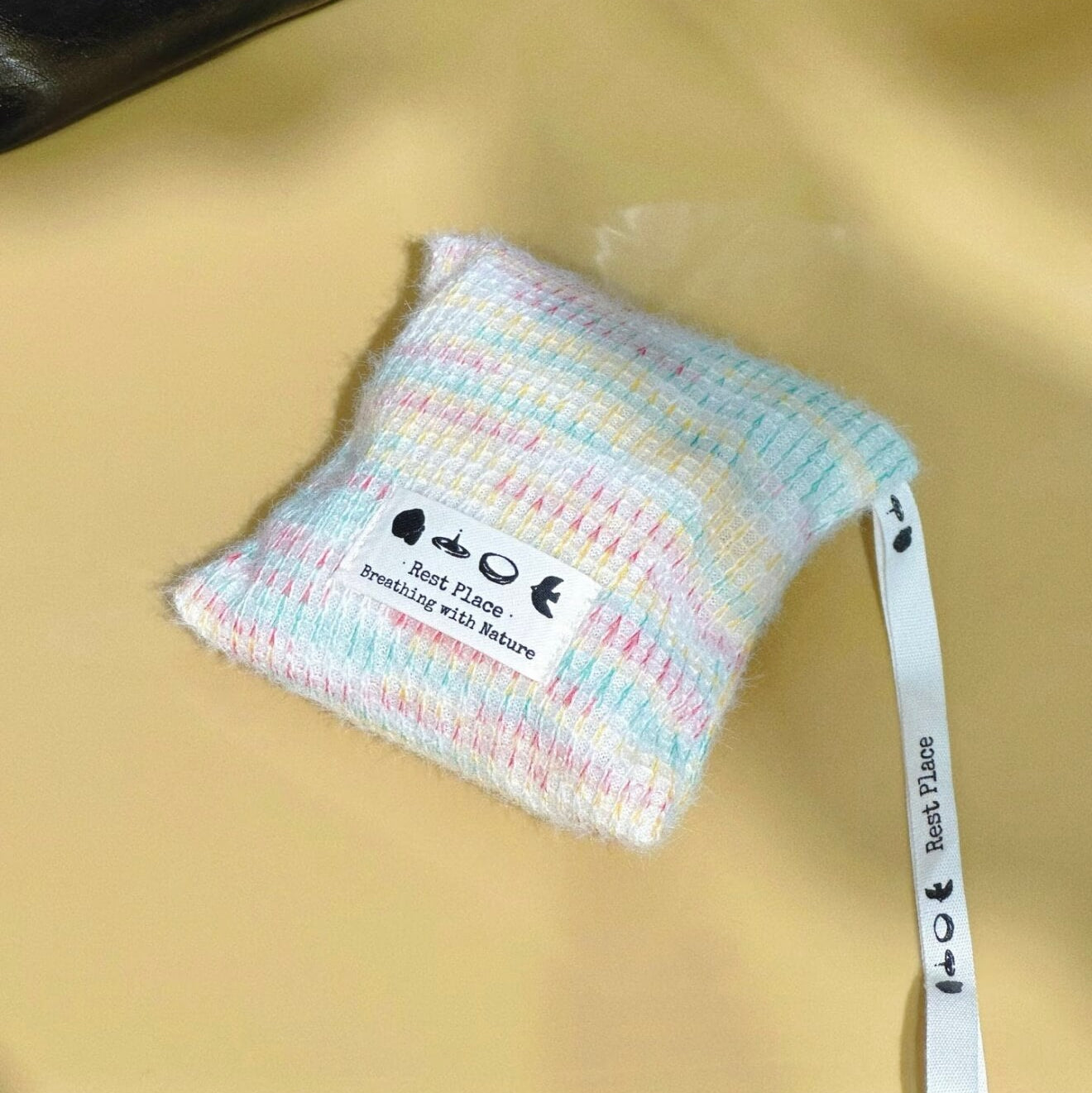Handcrafted Earth Haven herbal balance sachet by CIRCLEARA, featuring a multi-color artisan woven pouch filled with premium natural lavender and cedarwood botanical herbs.