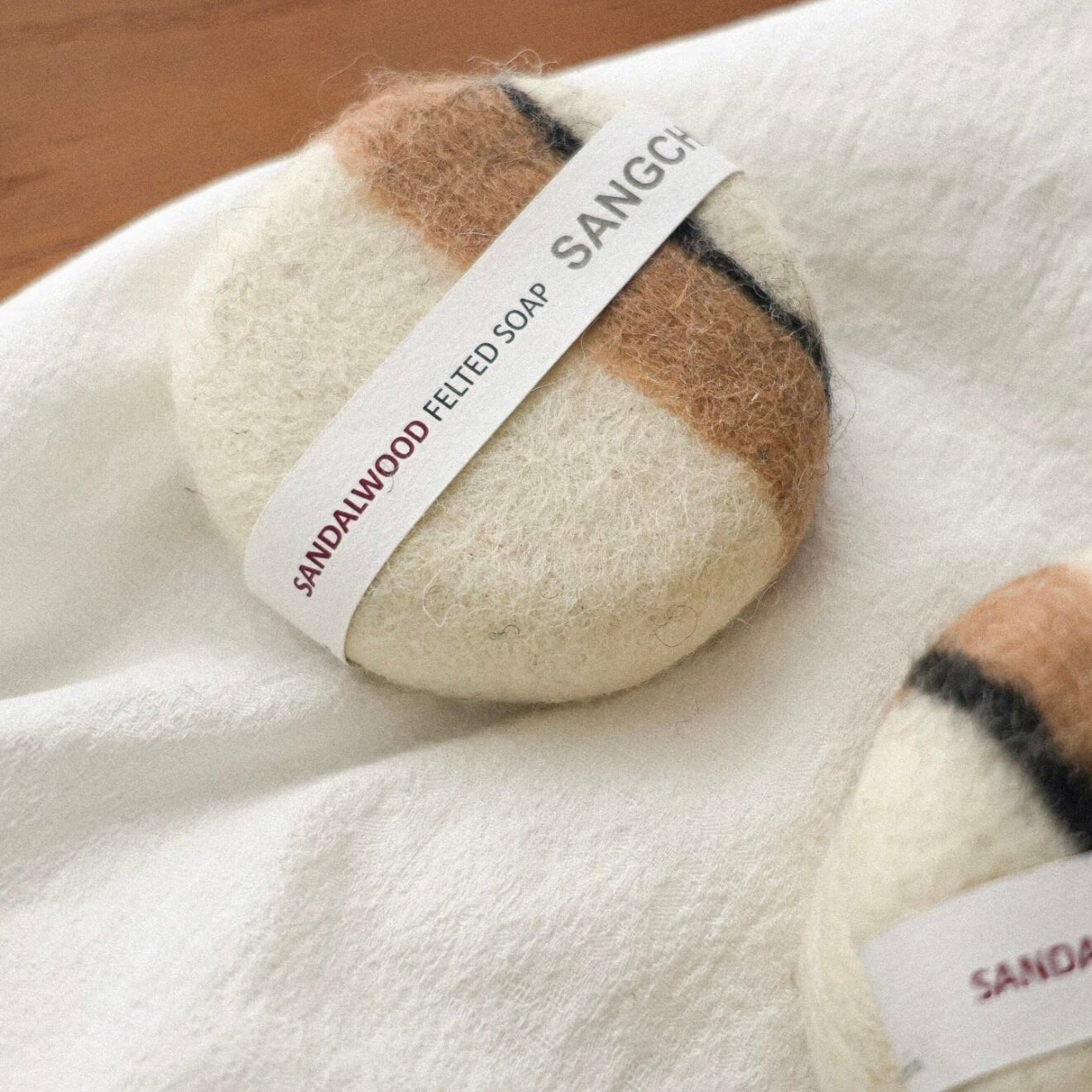 Close-up of the Kali Gandaki felted soap with striped wool patterns, highlighting the raw texture and artisanal Himalayan craftsmanship.
