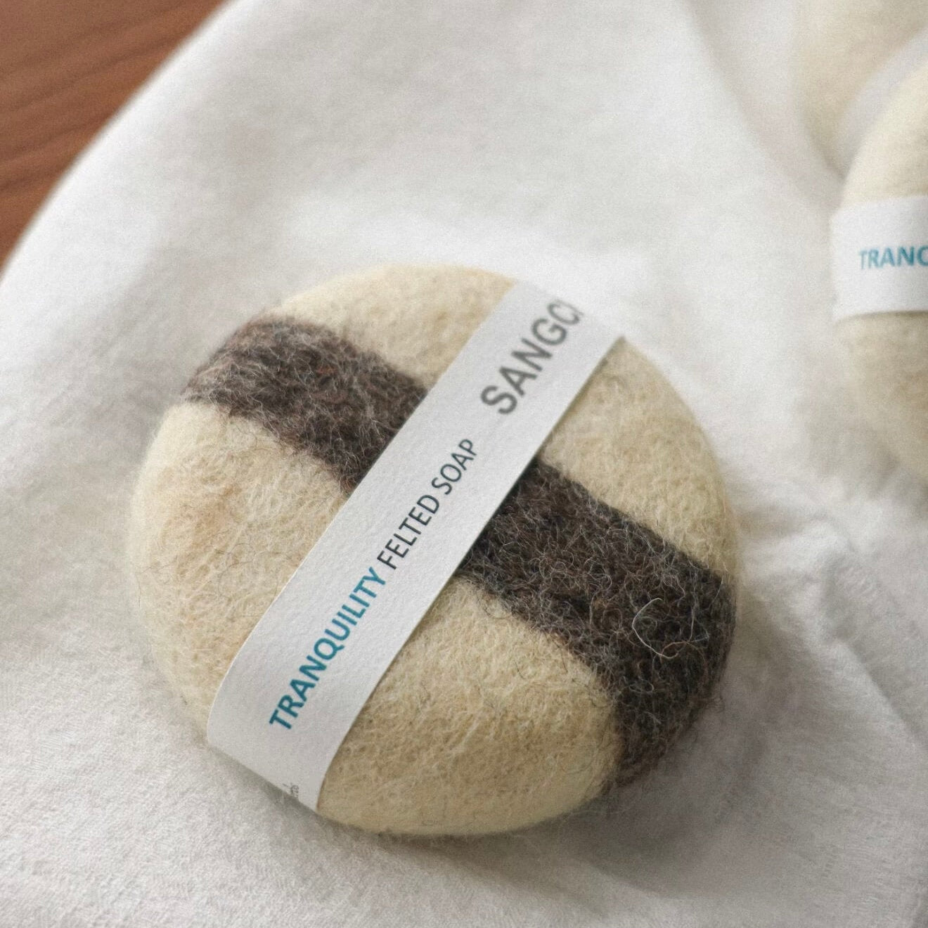 Close-up of the Kali Gandaki felted soap with striped wool patterns, highlighting the raw texture and artisanal Himalayan craftsmanship.