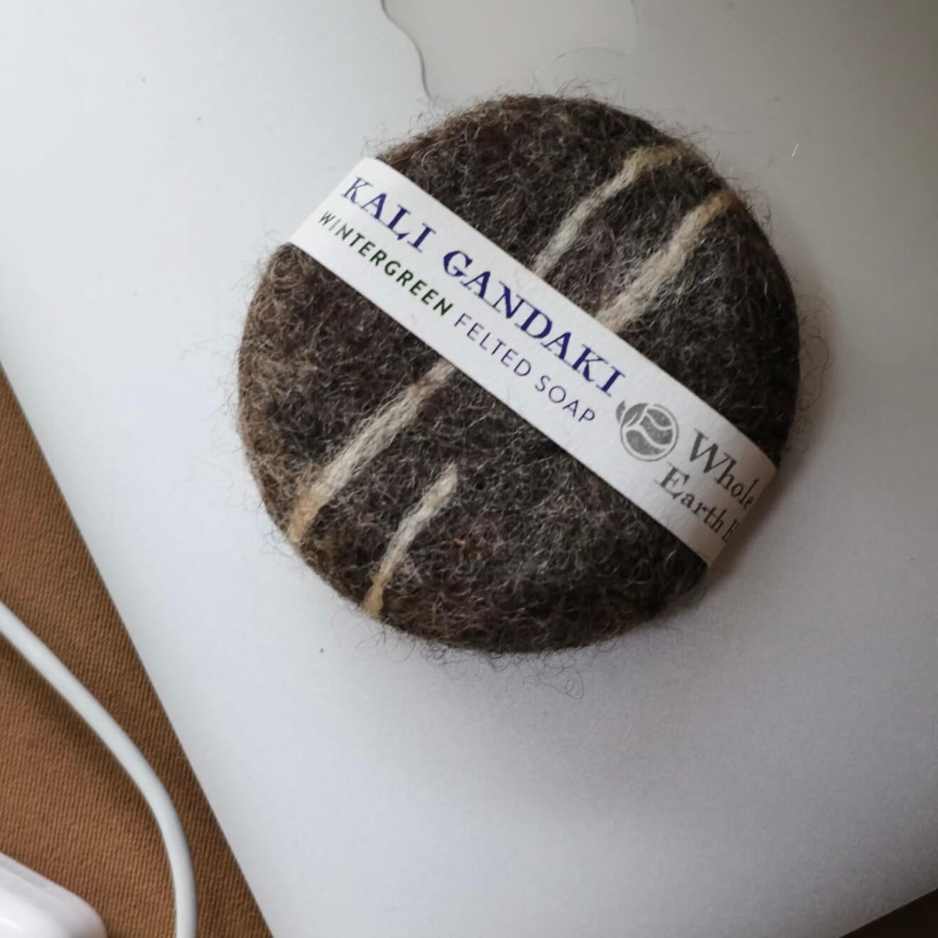 Close-up of the Kali Gandaki felted soap with striped wool patterns, highlighting the raw texture and artisanal Himalayan craftsmanship.