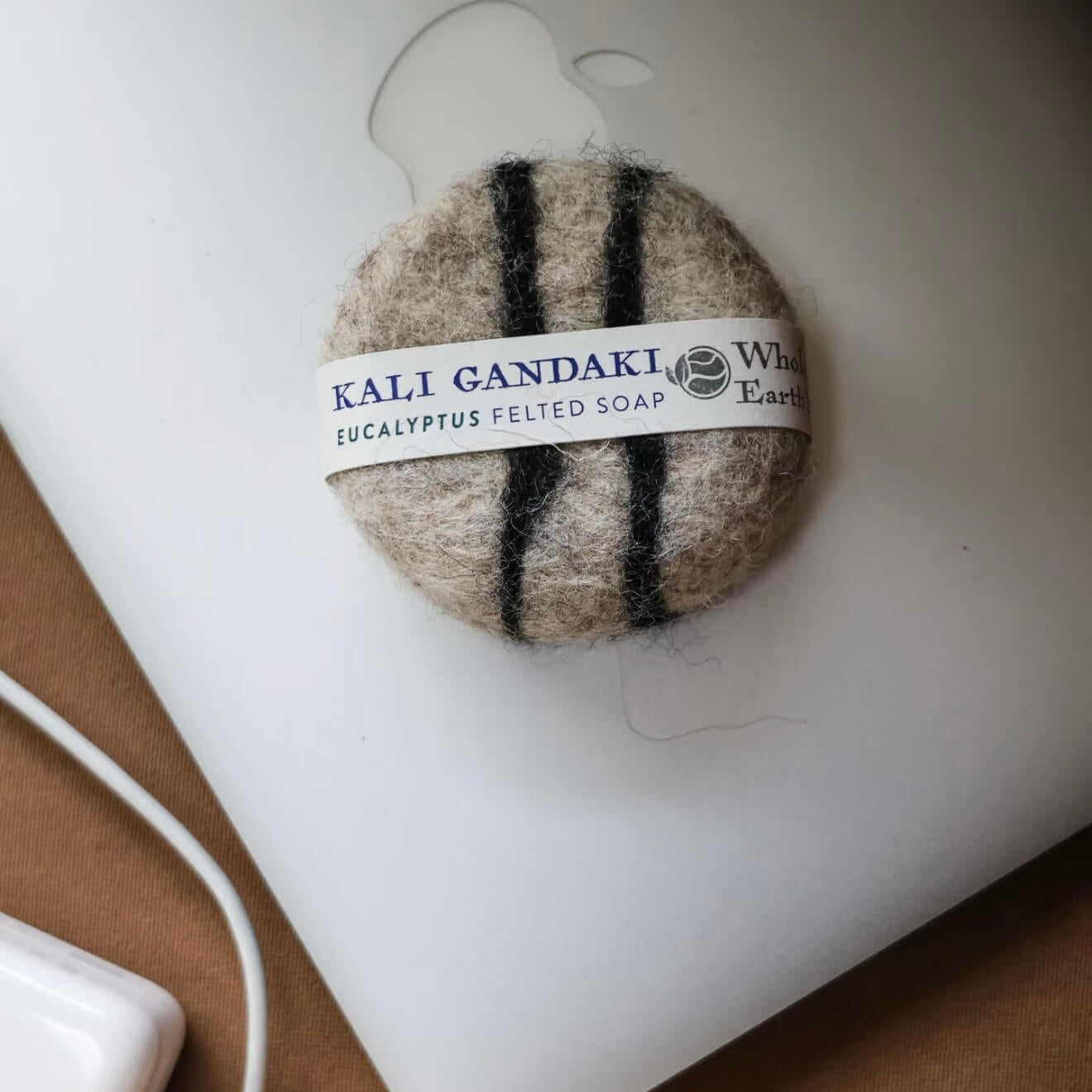 Close-up of the Kali Gandaki felted soap with striped wool patterns, highlighting the raw texture and artisanal Himalayan craftsmanship.
