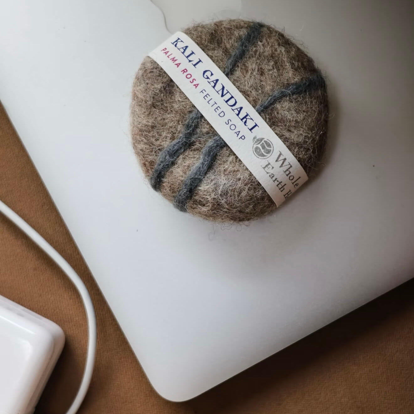 Close-up of the Kali Gandaki felted soap with striped wool patterns, highlighting the raw texture and artisanal Himalayan craftsmanship.