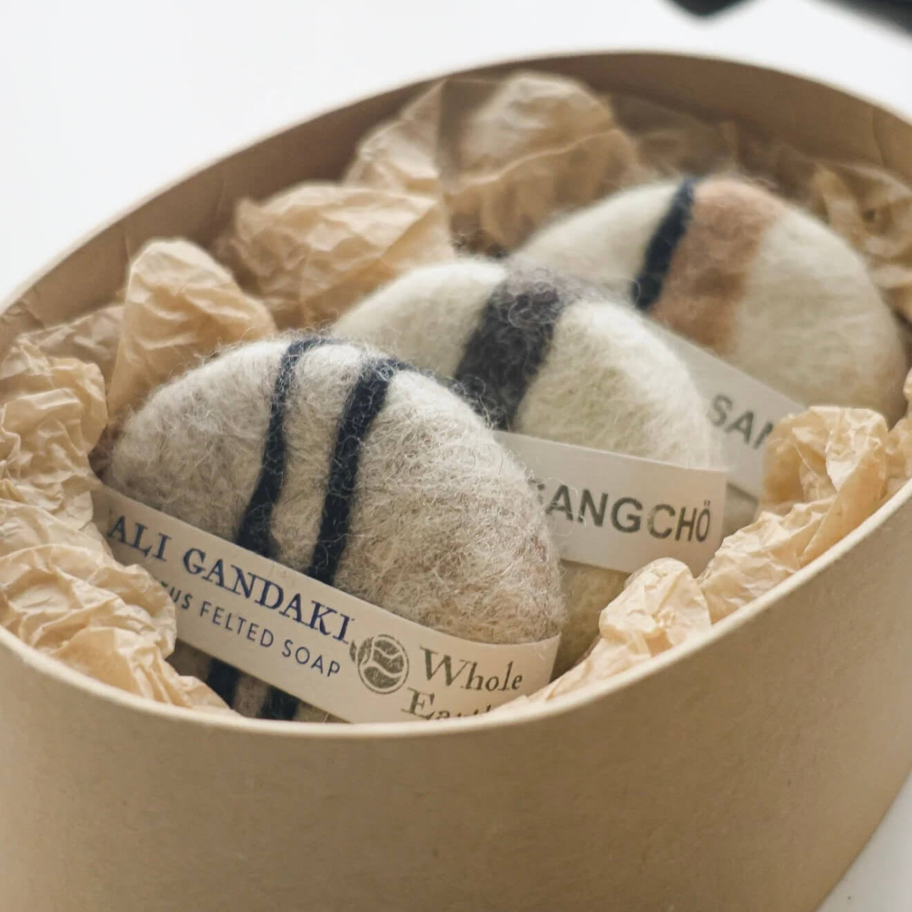Close-up of the Kali Gandaki felted soap with striped wool patterns, highlighting the raw texture and artisanal Himalayan craftsmanship.