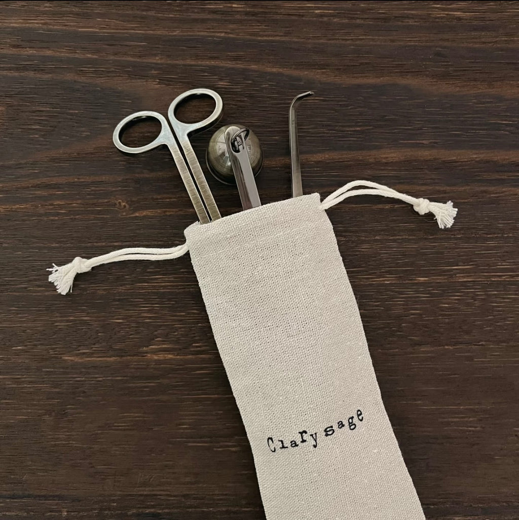 A set of CIRCLEARA candle care ritual tools in five metallic finishes, showing the weighted wick trimmer and bell snuffer in high-detail electroplating.