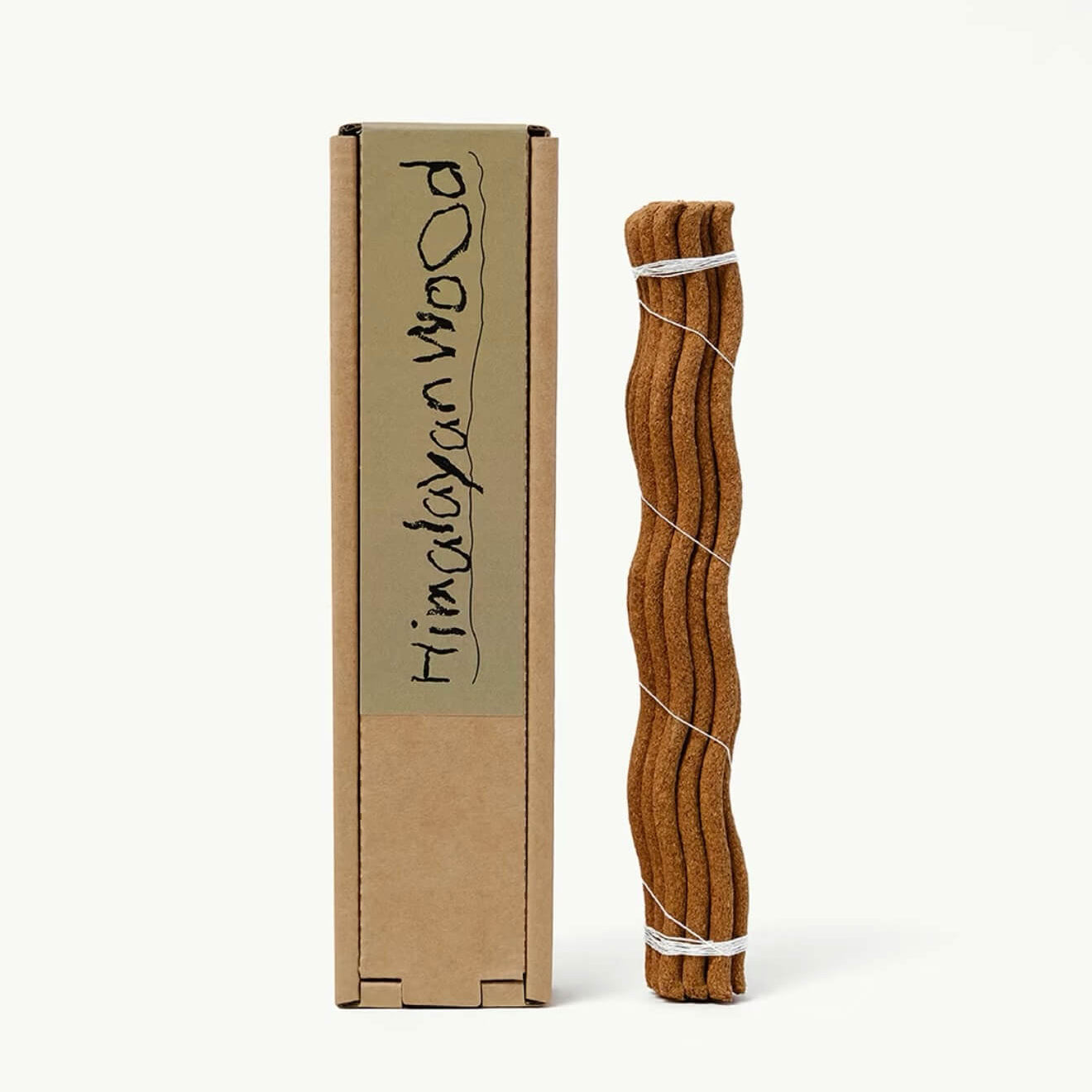 A single wavy botanical incense stick by CIRCLEARA in a red terracotta holder, representing a fluid energy reset.