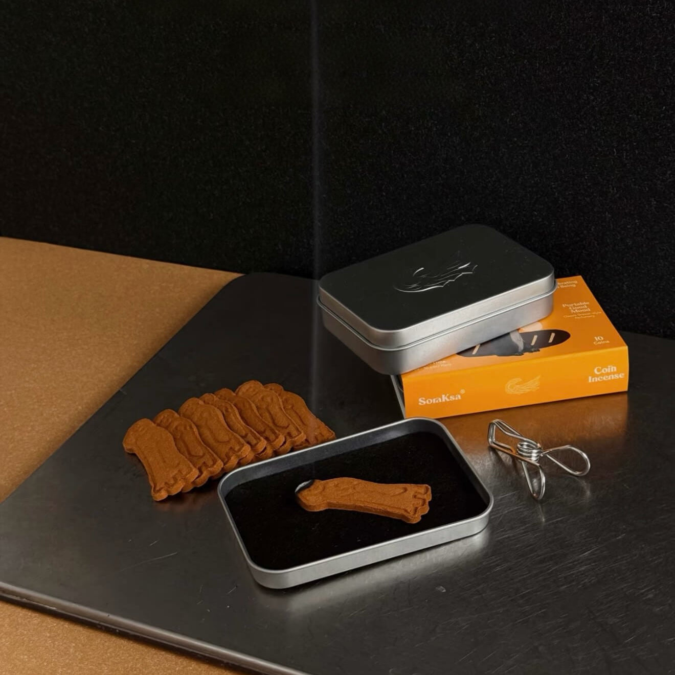 A set of CIRCLEARA SoraKsa collaboration compressed coin incense tablets in artistic shapes, representing a portable emotional sanctuary.