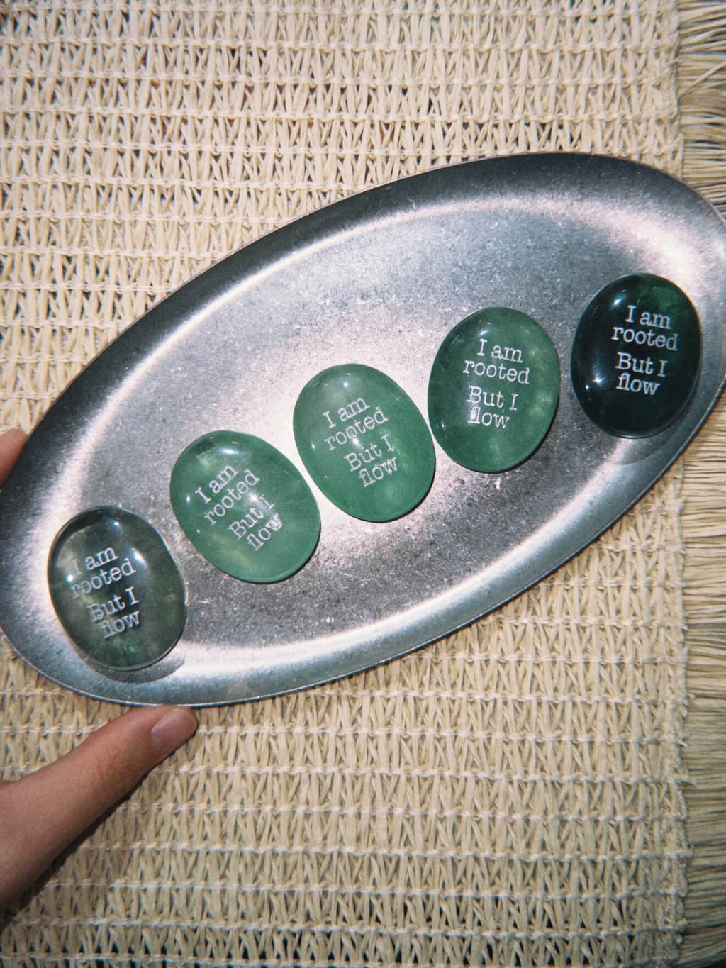 CIRCLEARA "I am rooted, But I flow" etched Green Aventurine stone. A tactile grounding mineral for heart chakra stability and navigating life's transitions.