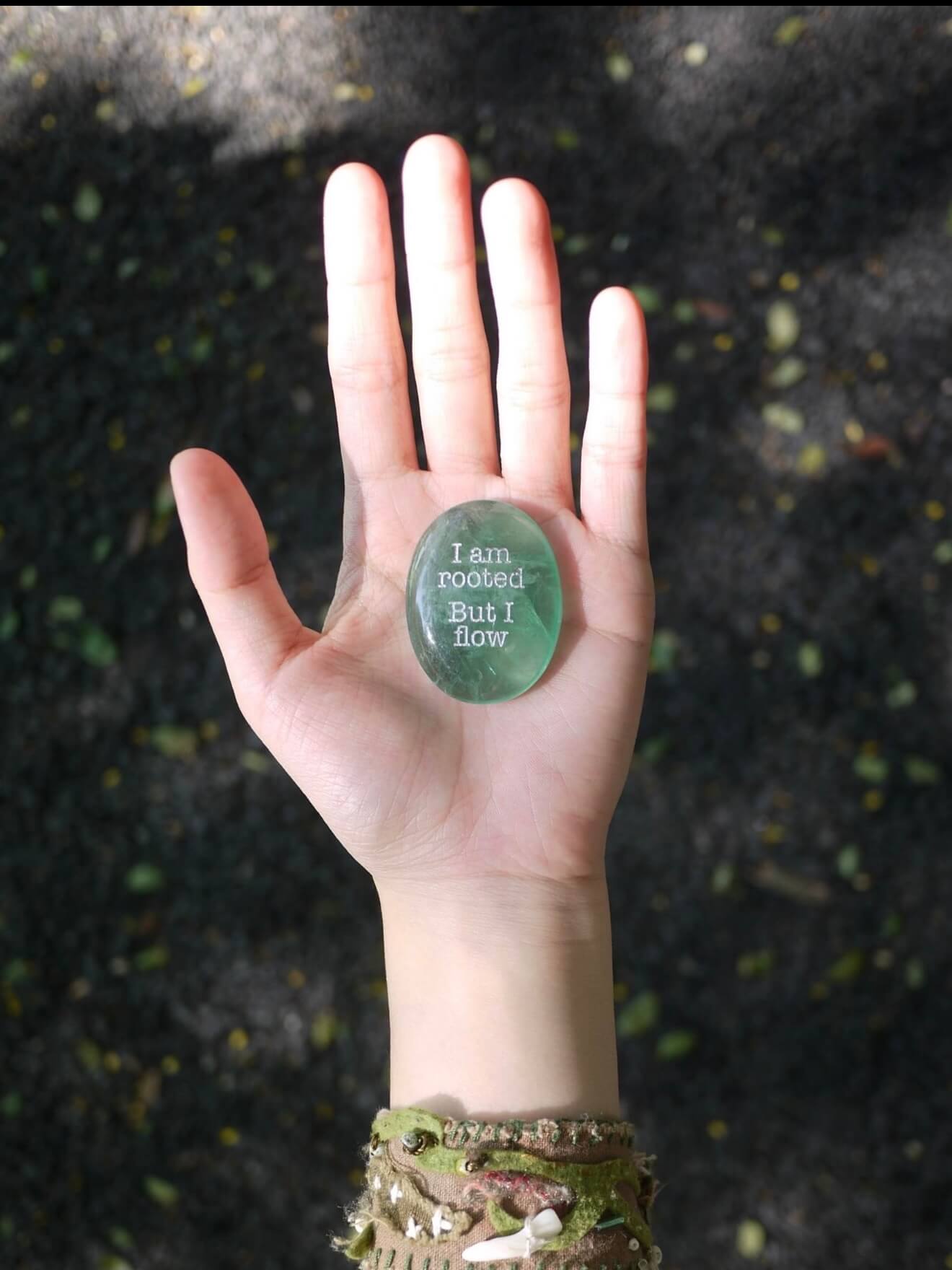 CIRCLEARA "I am rooted, But I flow" etched Green Aventurine stone. A tactile grounding mineral for heart chakra stability and navigating life's transitions.