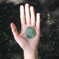 CIRCLEARA "I am rooted, But I flow" etched Green Aventurine stone. A tactile grounding mineral for heart chakra stability and navigating life's transitions.