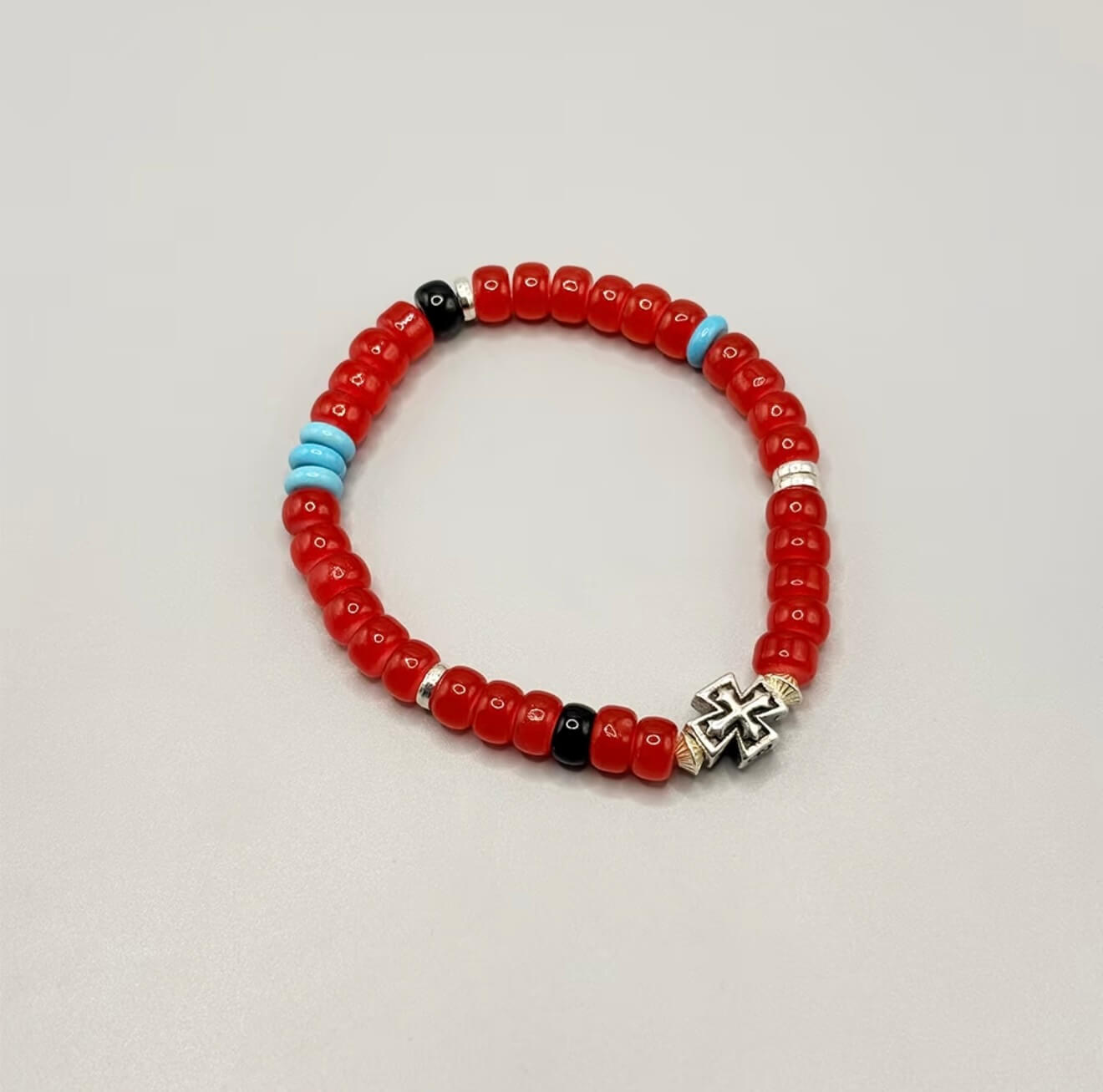 CIRCLEARA Crimson Compass Men's Bracelet with red glaze beads and silver cross. A tactile grounding tool and minimalist gift for daily focus.