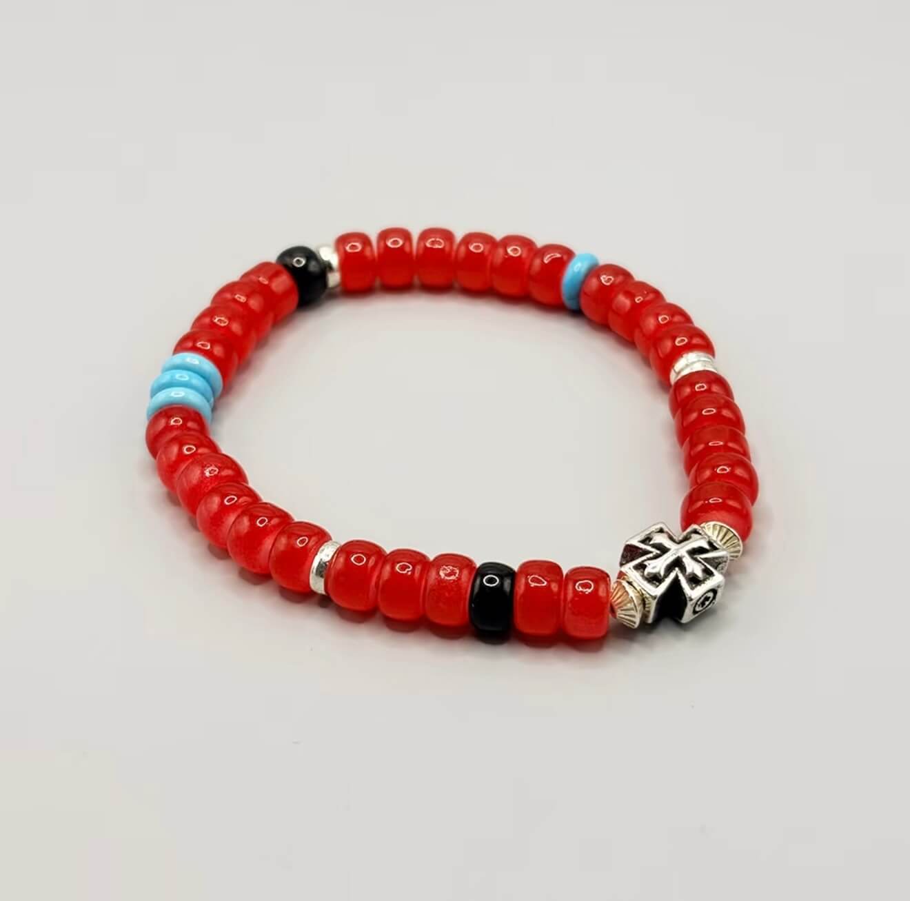 CIRCLEARA Crimson Compass Men's Bracelet with red glaze beads and silver cross. A tactile grounding tool and minimalist gift for daily focus.
