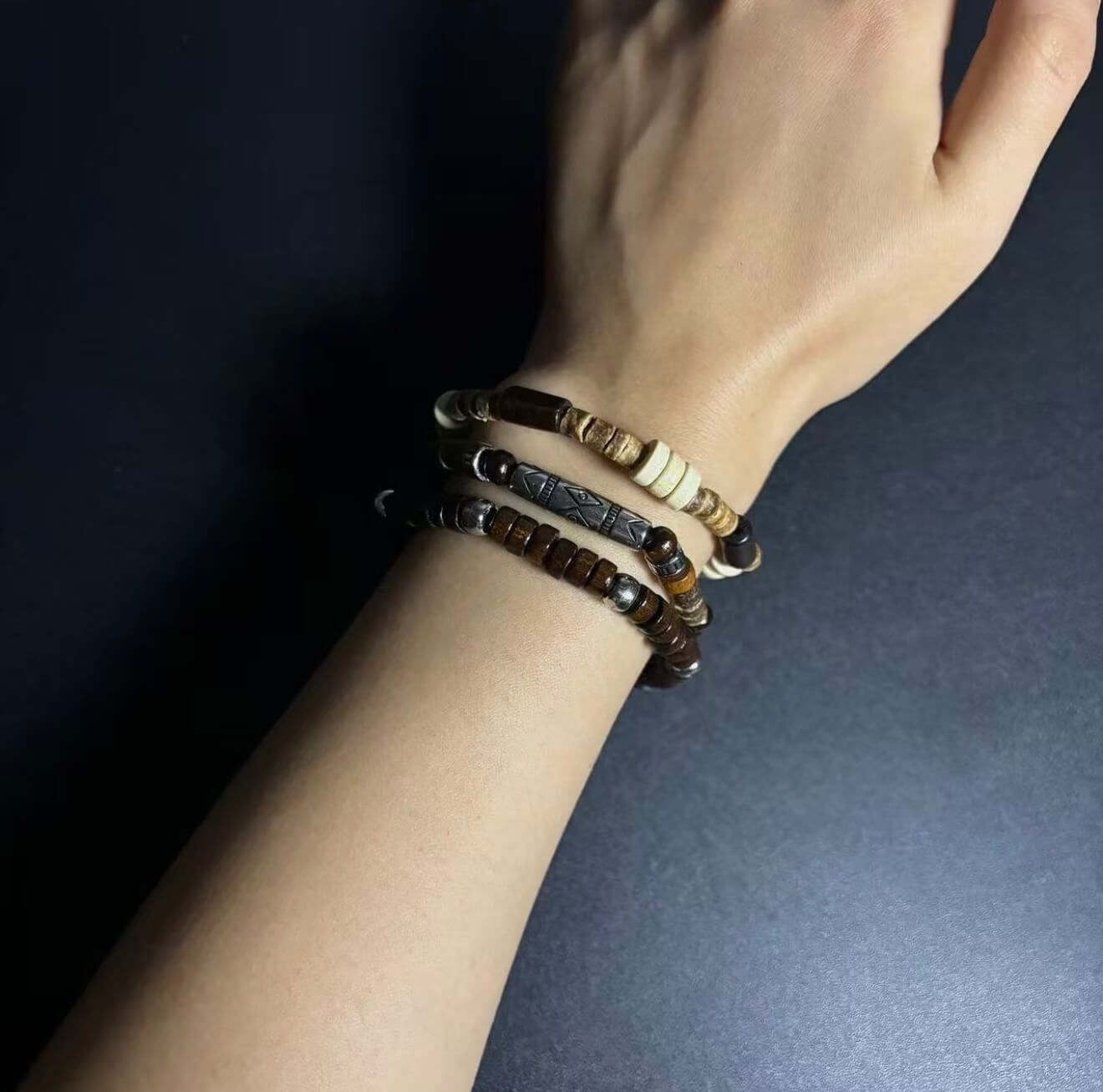 CIRCLEARA Terrane Nomadic Stack: 5-piece wooden bead bracelet set in forest green and charcoal. A minimalist grounding gift for couples and nature lovers.