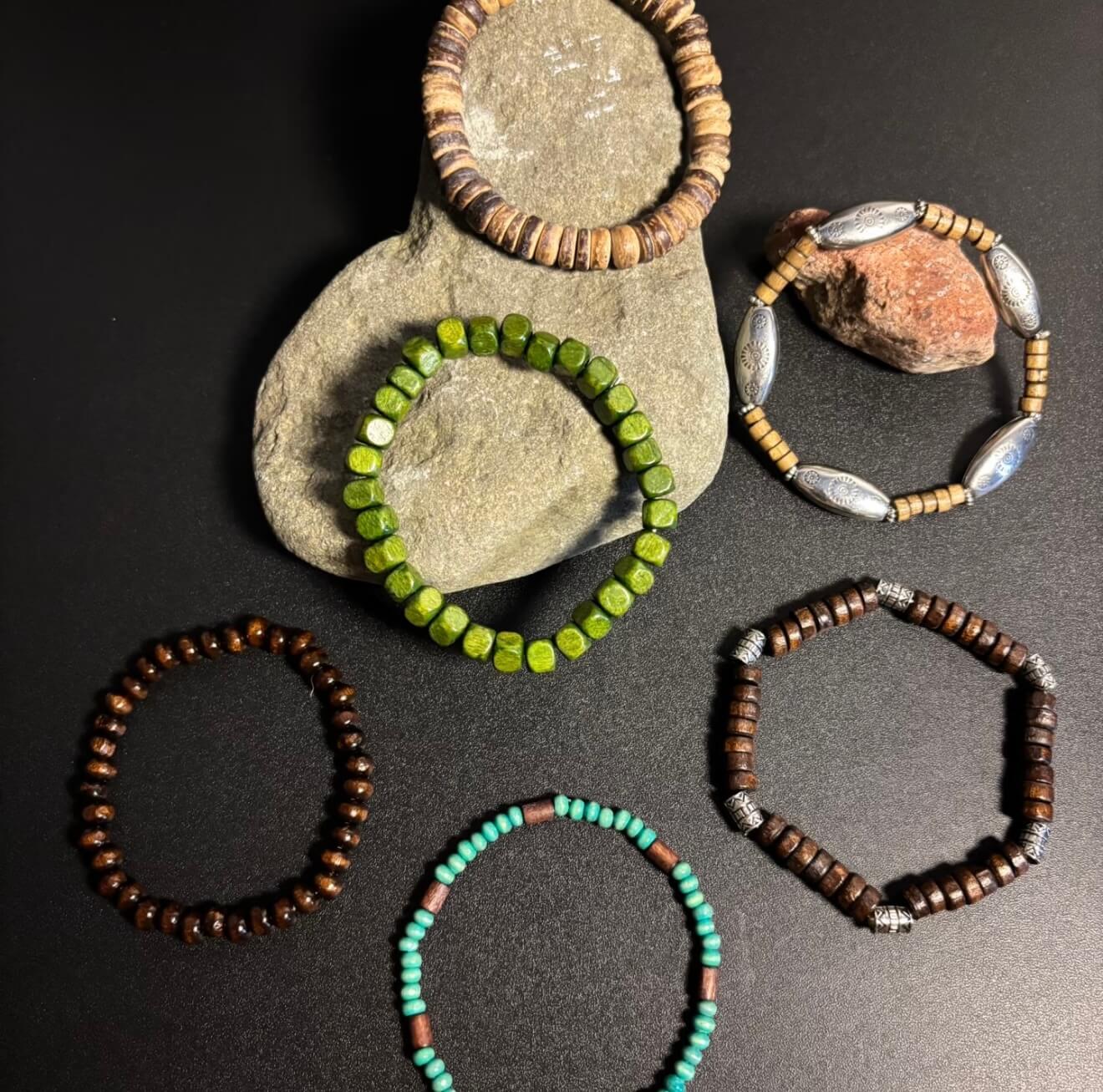 CIRCLEARA Terrane Nomadic Stack: 5-piece wooden bead bracelet set in forest green and charcoal. A minimalist grounding gift for couples and nature lovers.