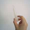 Handcrafted natural clear quartz magic wand engraved with silver 'Bibbidi-Bobbidi-Boo' and stars by CIRCLEARA, showing internal natural ice-fracture textures.