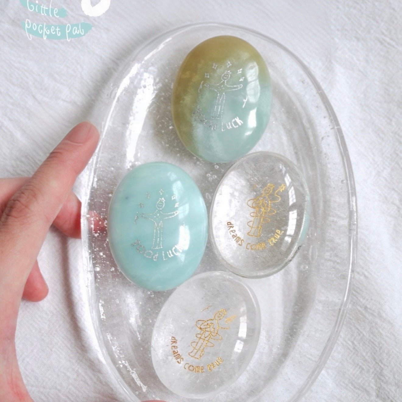 Handcrafted 46mm natural Amazonite and Rose Quartz pocket friend stones by CIRCLEARA, featuring silver-etched whimsical character engravings for best friends.
