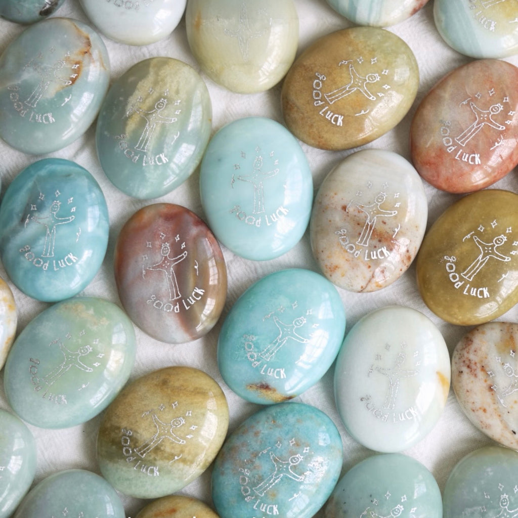 Handcrafted 46mm natural Amazonite and Rose Quartz pocket friend stones by CIRCLEARA, featuring silver-etched whimsical character engravings for best friends.