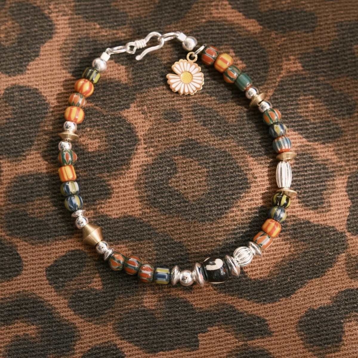Handcrafted 6.3mm natural cherry-red Nanhong agate beaded bracelet with a 925 sterling silver vintage sunburst charm, by CIRCLEARA.
