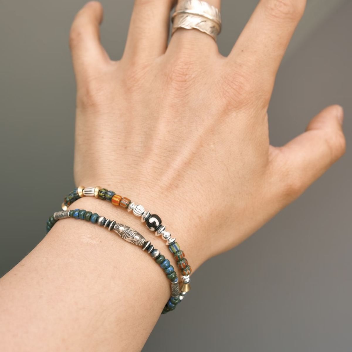 Handcrafted 6.3mm natural cherry-red Nanhong agate beaded bracelet with a 925 sterling silver vintage sunburst charm, by CIRCLEARA.