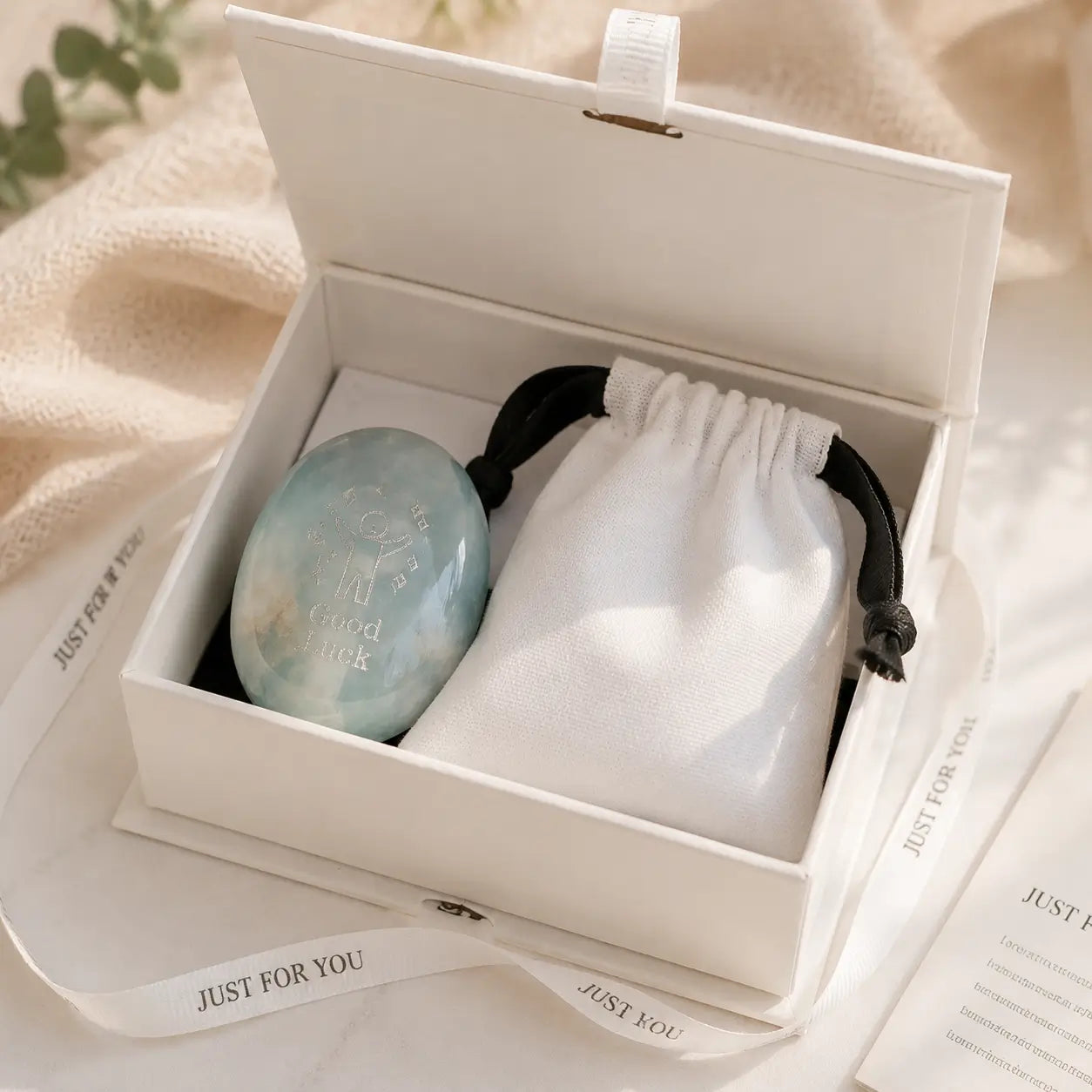 Handcrafted 46mm natural Amazonite and Rose Quartz pocket friend stones by CIRCLEARA, featuring silver-etched whimsical character engravings for best friends.