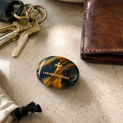 Handcrafted dual Tiger's Eye grounding palm stone by CIRCLEARA, featuring a golden engraved mindfulness quote "I AM UNSTOPPABLE" with rich amber and black banded crystal textures.